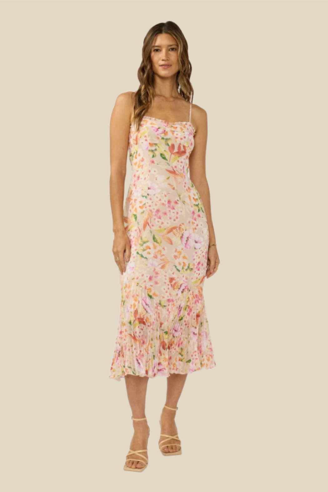 Woman wearing a floral dress on a beige background