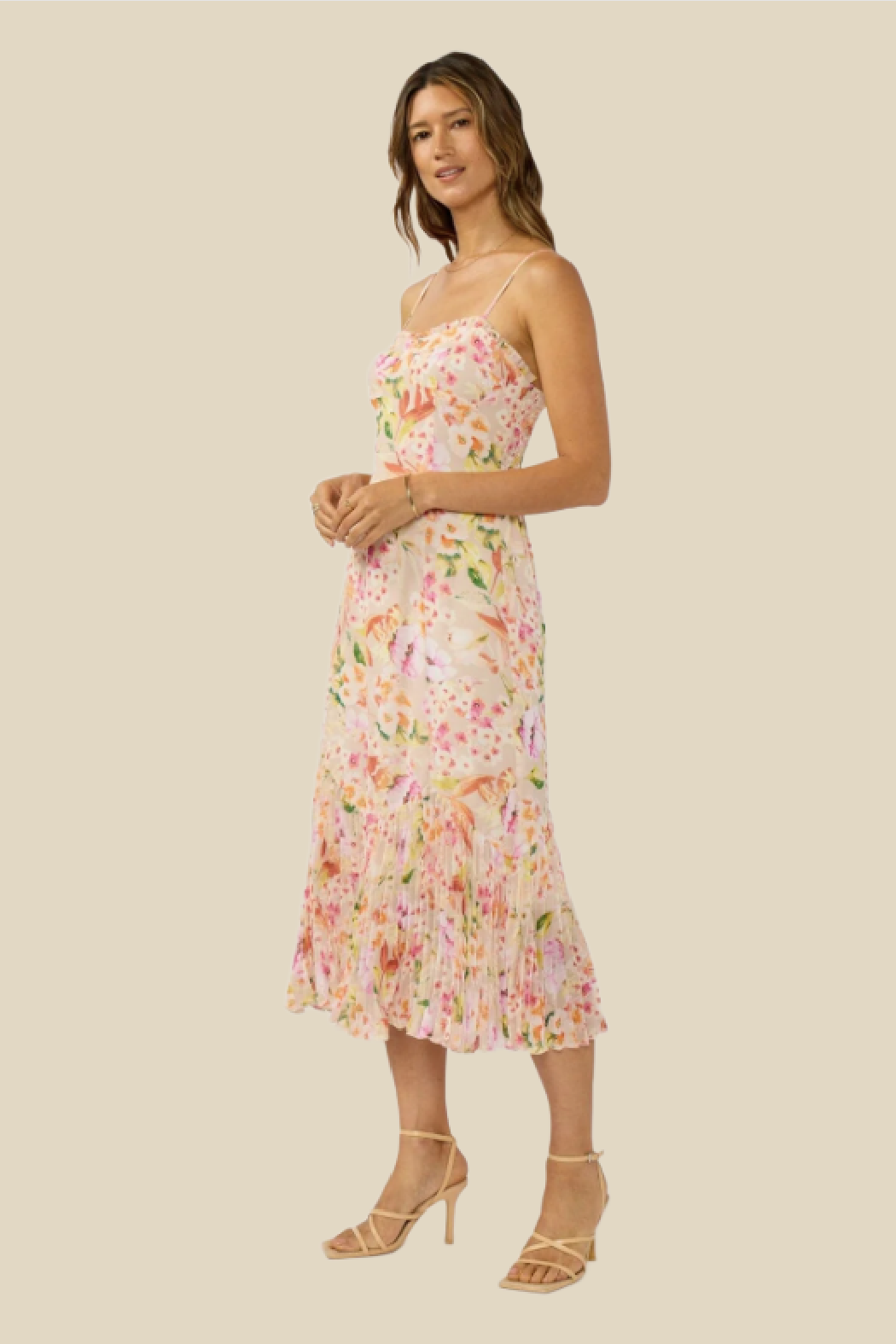 Woman wearing a floral dress on a beige background